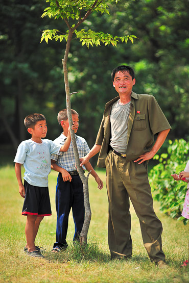 father with sons in the park on liberation day